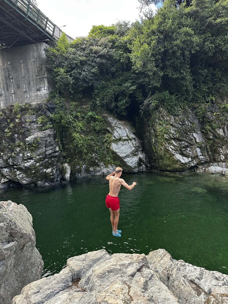 Jumping off the boulders into the Pelorus River