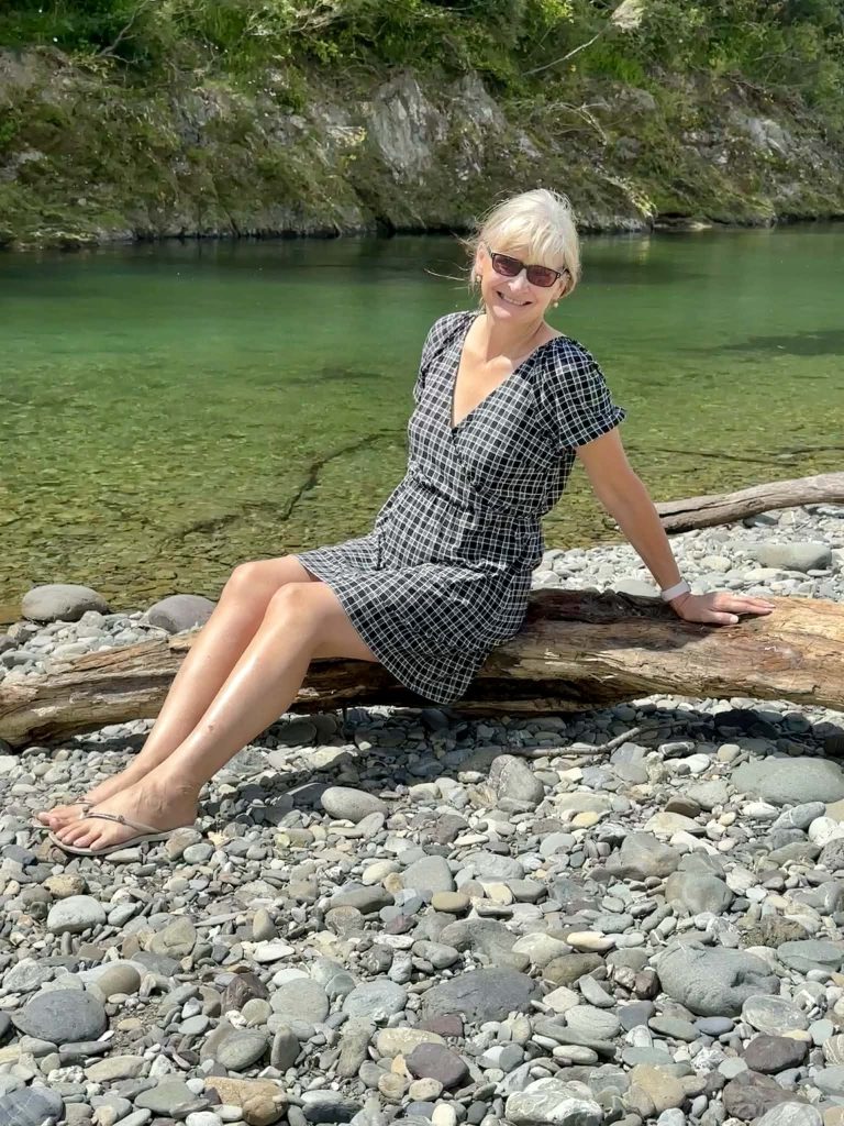 Megan on the rocky beach of the Pelorus River